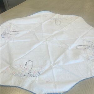 Embroidered White doily with Blue Trim basket of flowers pattern